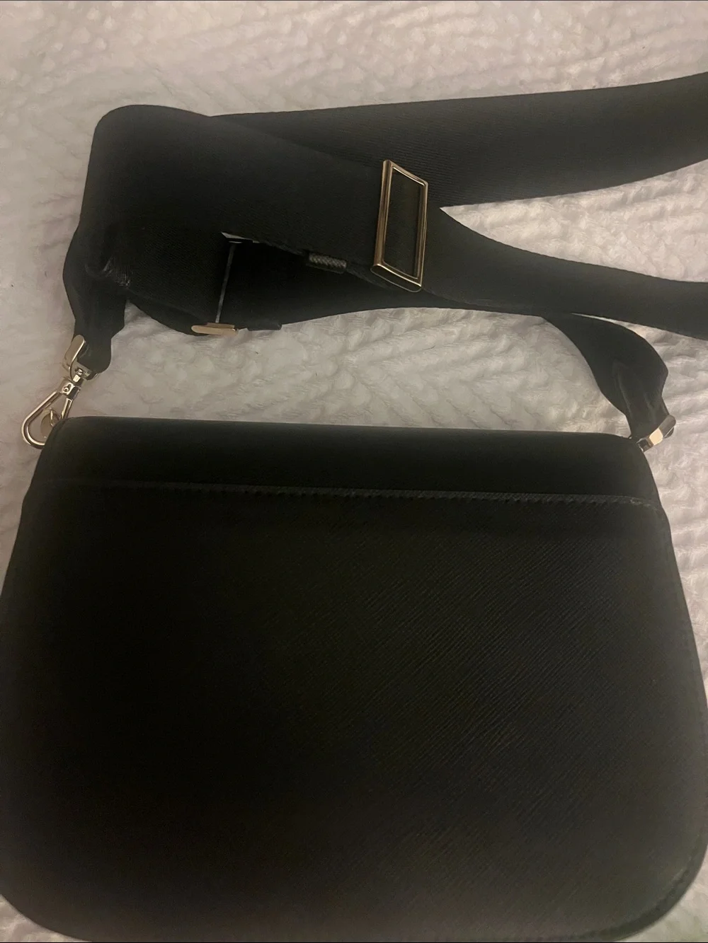 Kate Spade black crossbody saddlebag with gold logo